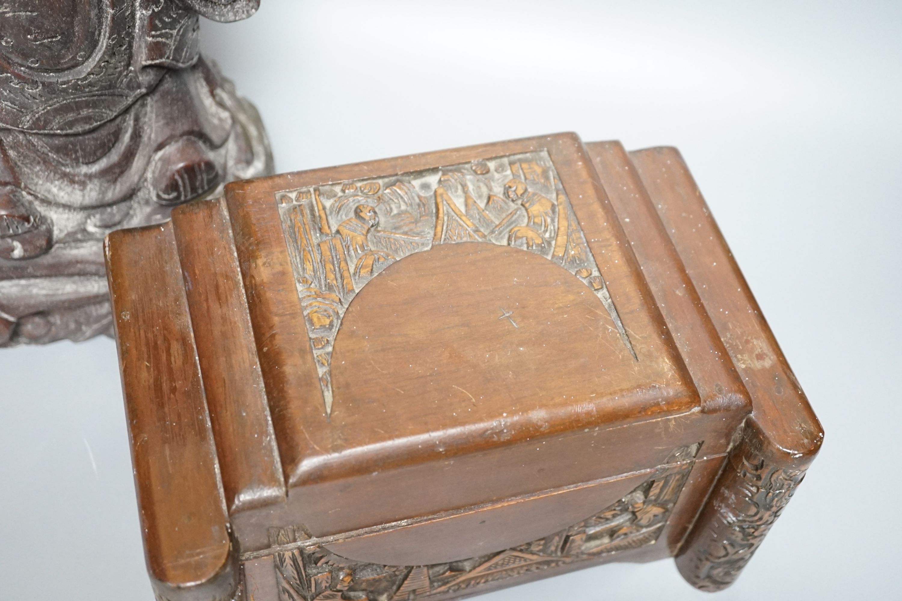 A Chinese carved wood sage and small carved trunk, Sage 47 cms high.